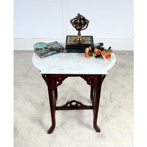 A charming Arts & Crafts marble top occasional table dating to around 1900-1910 The table features a shaped white marble...