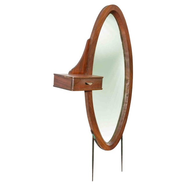Vintage oval mirror is an original design item realized in the mid-20th century. A vintage wooden mirror with a little...