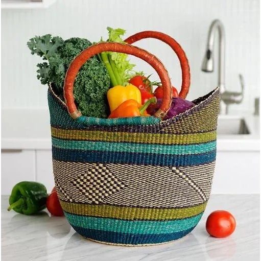 Artisans in the Bolgatanga region of Ghana weave these beautiful and durable baskets from thick, tough elephant grass. A...