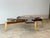 The Rootspan Coffee Table is a striking sculptural centerpiece crafted from a cross-cut section of a walnut tree root,...