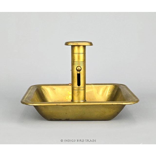 Antique Brass Push Up Chamberstick Candle Holder This solid brass chamberstick from the 1840's has an adjustable pusher,...