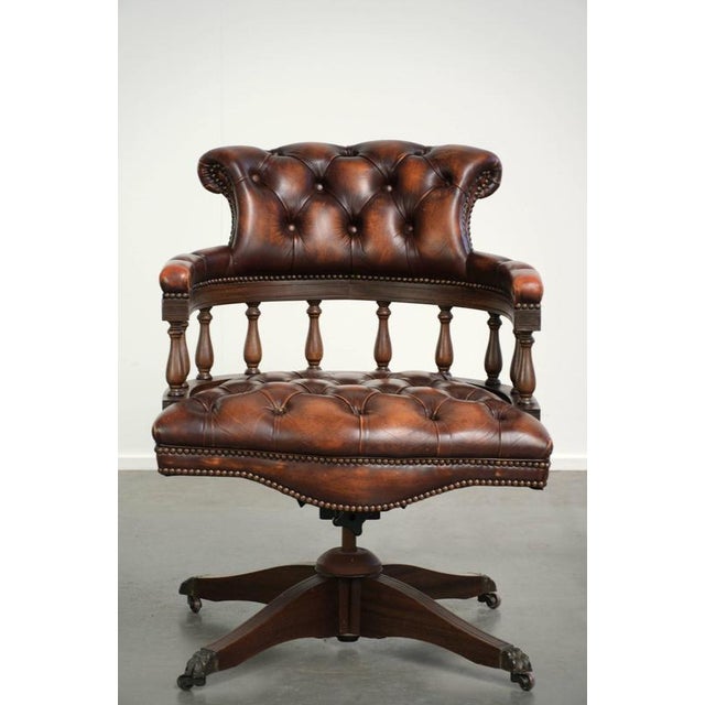 This luxurious English cowhide leather Chesterfield office chair features a beautiful, rich brown color full of character....