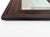 An authentic 19th-century American Empire Ogee wall mirror featuring richly figured flame mahogany veneer. The frame...