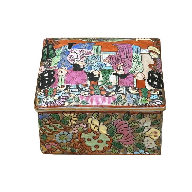 This vintage porcelain trinket box is a vibrant example of Chinese famille rose style, featuring a rectangular body and a...