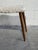 Vintage Danish Mid Century Modern vanity stool featuring elegant tapered teak legs and upholstered sheepskin-style fabric...