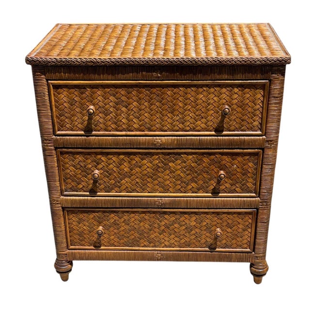 Vintage wicker and cane 3-drawer chests or nightstands that are possibly Henry Link for Lexington. They have a wrapped...