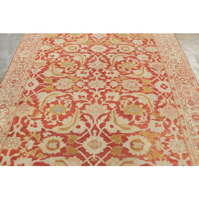 Handwoven in wool, circa 1900–1920, this antique 6x9 Mahal rug features an expressive all-over botanical design in rich...