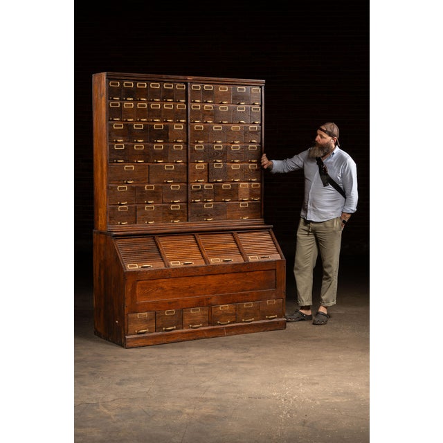 c. 1910s-1920s; W.C. Heller & Co. - Montpelier, OH Massive multi-section oak hardware cabinet produced by W.C. Heller &...