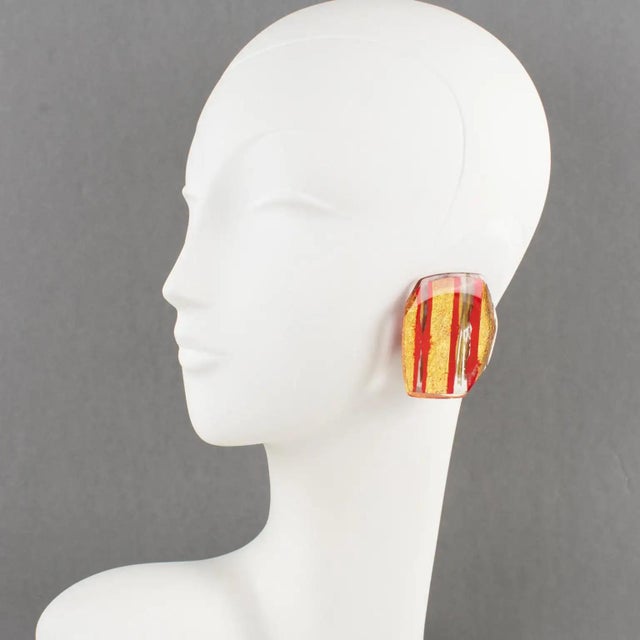 These stunning Anne and Frank Vigneri Lucite clip-on earrings feature an oversized, dimensional geometric design, all...