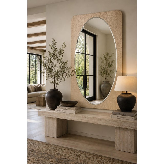 Elevate your space with this sophisticated contemporary wall mirror featuring a distinctive pearlescent frame in a soft...