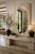Elevate your space with this sophisticated contemporary wall mirror featuring a distinctive pearlescent frame in a soft...