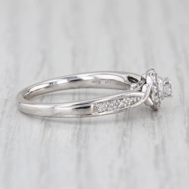 Gemstone Information: - Natural Diamonds - Total Carats - 0.28ctw (center 0.08ct, 0.20ctw Accents) Cut - Round Brilliant...