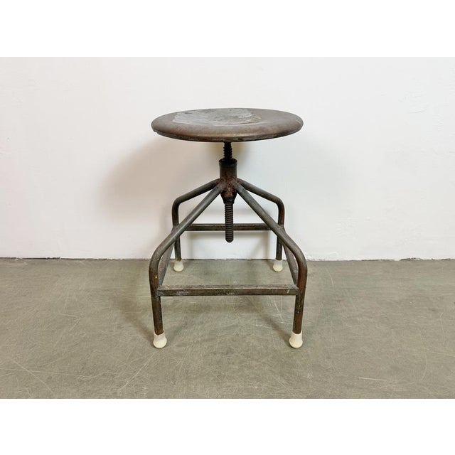 Industrial iron four-legged height adjustable medical stool made in former Czechoslovakia during the 1960s. Min.- Max....