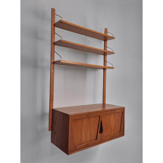 Teak Wall Storage Cabinet by Kjell Riise, 1960s, in Very Good conditions. Designed 1960 to 1969 This piece has an...