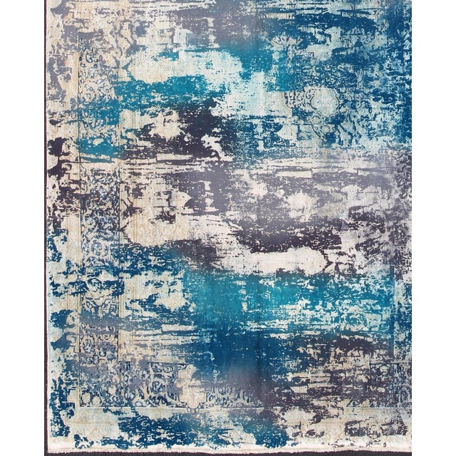 Vintage Rug in Modern Design in Shades of Blue, Gray, and Ivory This Persian carpet with a classical composition has been...