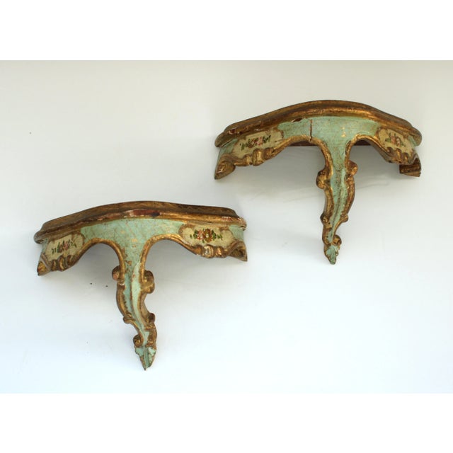 Exceptional set of three petite Italian Florentine style giltwood carved wood wall brackets. Beautiful patina, Turn of the...