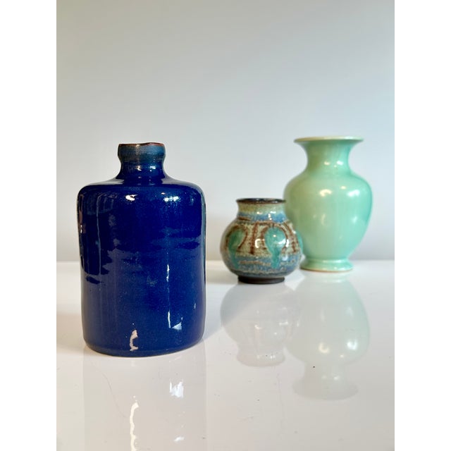Hand-thrown studio ceramic vase in a cylindrical bottle shape from the 1970s. The vessel is distinguished by its high-...