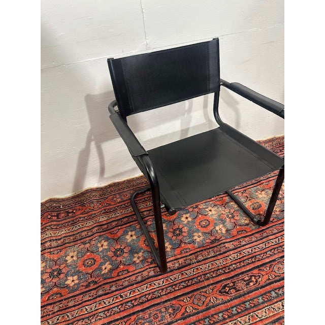 Discover the sleek, minimalist beauty of these Mart Stam Black Leather Cantilever Chairs, perfect for those who appreciate...