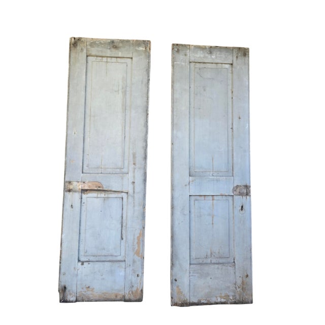 A great pair of early American shutters with original hinges. Soft wood, pegged, naturally weather soft gray on one side...