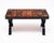 Coffee table with tiled top from Vallauris on the French Riviera. The table has a structure is made of metal. The top is...