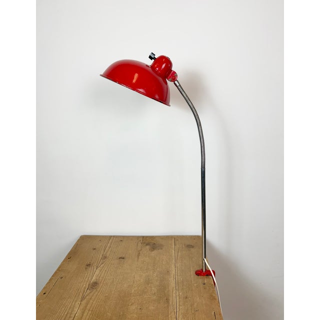 Vintage industrial gooseneck adjustable workshop table lamp made by Helo Leuchten in Germany during the 1950s. It features...