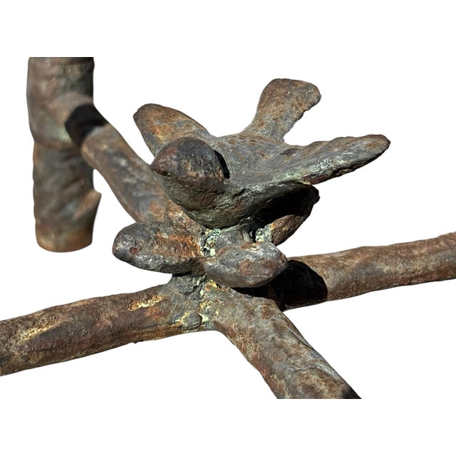 A heavy and sculptural iron side table in the manner of Diego Giacometti’s iconic “Arbred Au Hibou” design. Highly...