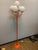 Vintage Metal Floor Lamp in Orange from Kaiser Idell / Kaiser Leuchten, 1960s, in Good conditions. Designed 1970 to 1979...