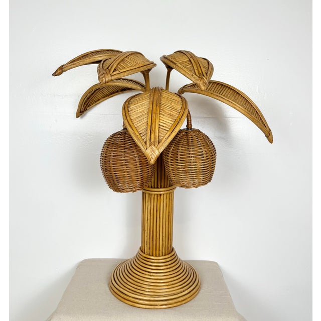 Vintage pencil reed rattan coconut palm tree table lamp. Adjustable rattan pam leaves over wicker coconut shades. Pencil...