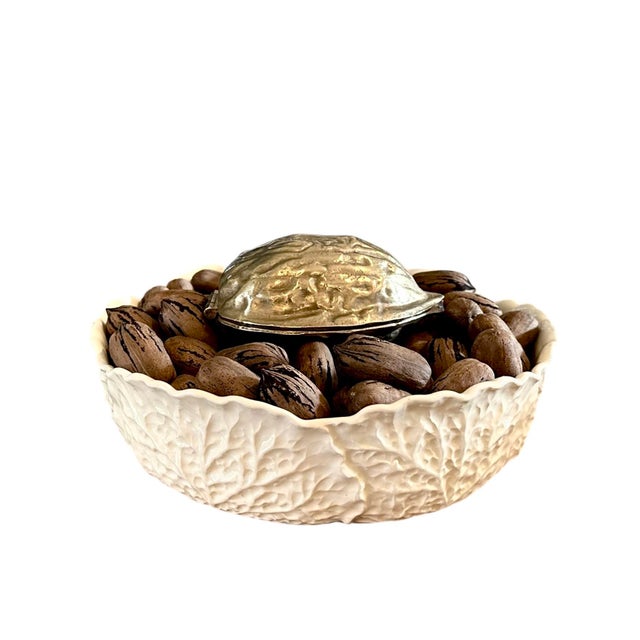 A lovely, vintage brass nutcracker. Features a cast solid brass walnut that opens to reveal a fixed double sided...