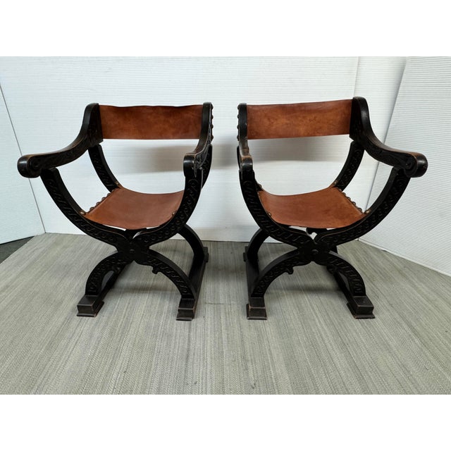 Design Plus Gallery presents a Pair of Savonarola Chairs in the Renaissance-style. The chart are made with dark stained...