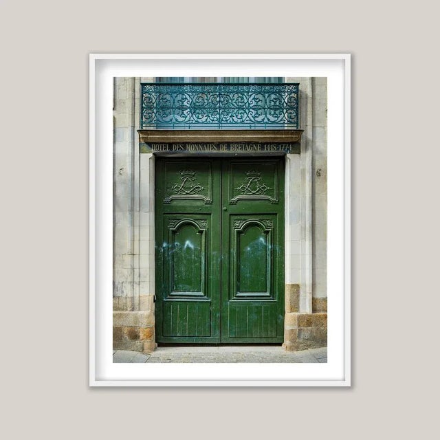 Historic European architecture often reveals its character at street level through tall, double doors - sometimes ornate,...