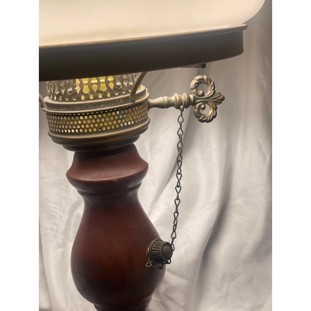 This Vintage Quoizel 3-Way Hurricane Lamp features a brass base with a wood accents, making it a unique and stylish...