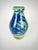 Bring handcrafted artistry into your home with this striking vintage hand-thrown studio pottery vase featuring layered...