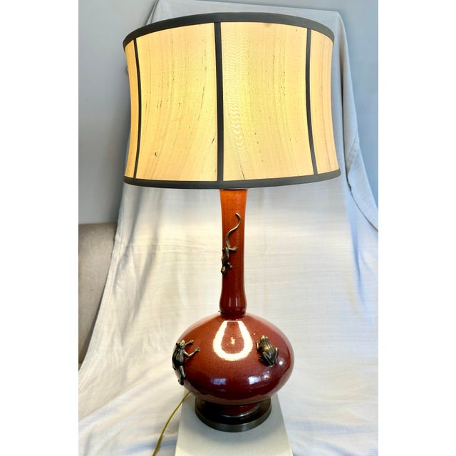 Iconic Currey & Co retired Oxblood Chameleon Table Lamps with original Gold Boned Silk Bell Shades; un-lacquered brass...