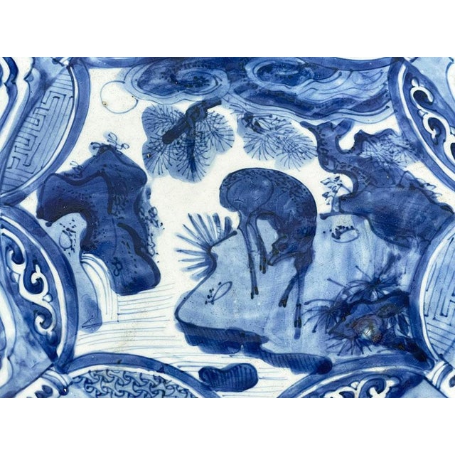 Large Blue and White "Kraak" porcelain charger, 17th Century A porcelain blue and white underglaze painted "Kraak" charger...