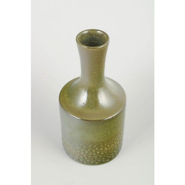 Hyonsun Rhee for Upsala Ekeby Vase, model 5044, 1960s. Cylindrical stoneware vase with green glaze and relief decoration...