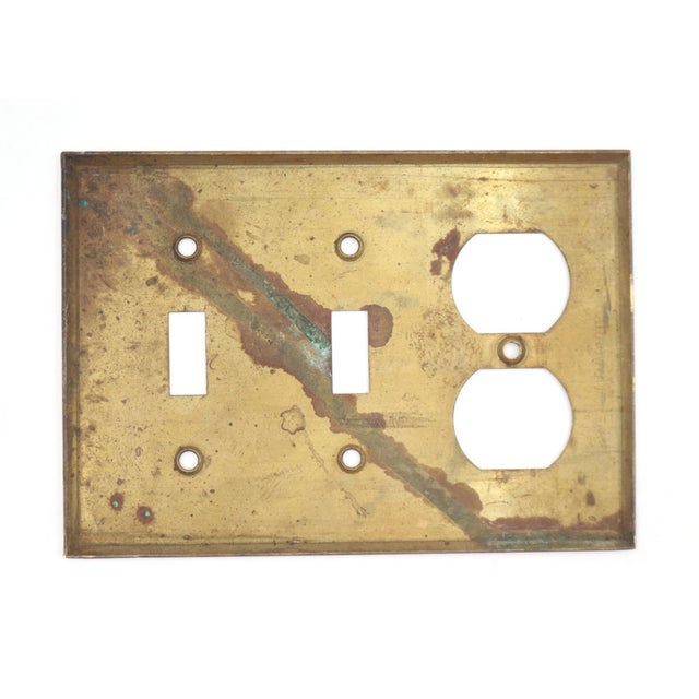 Vintage brass switch wall plate with a duplex outlet and two gangs. The original mounting screws are not available. Good...