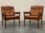 Teak frame and tufted leather upholstery. Marked to frame. Sweden, circa 1970s. Dimensions: H 32" x W 32" x D 27" x SH 16"...
