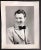 1935 black and white photograph of entertainer, singer and movie star Johnny Davis (1910-1983) smiling in a fancy 1930s...
