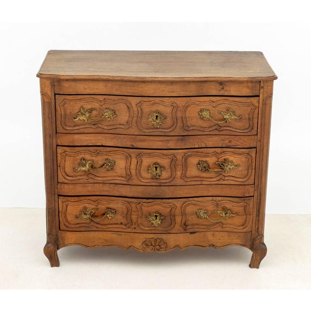 Baroque Oak Chest of Drawers, 18th century, the serpentine top above three long drawers. 38" H x 42" W x 20" D....