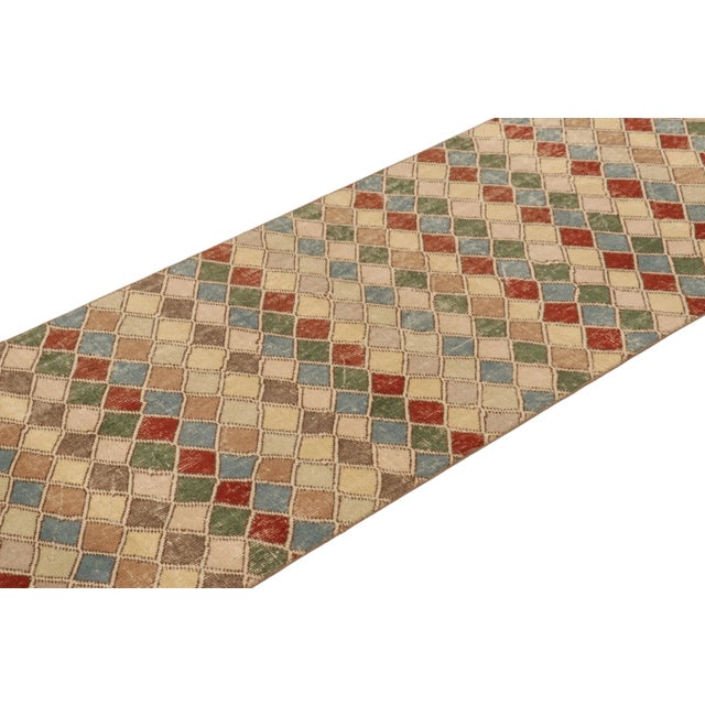 This vintage rug is a 3x9 Turkish distressed piece, made with hand-knotted wool circa mid-20th century. It is an exciting...