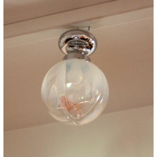 Chrome-plated ceiling lamp, Murano blown glass, Italy, 1960s. An authentic example of mid-century Italian design,...