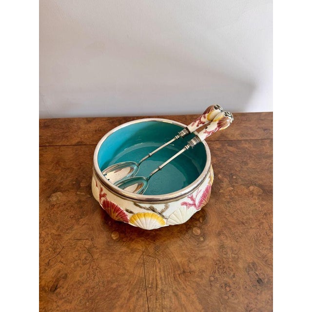 Quality antique 19th century majolica salad bowl and servers, having a quality majolica salad bowl decorated with embossed...