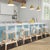 Evoking images of sidewalk tables in the Cote d'Azur, counter stools like this will give your kitchen, dining area, or...