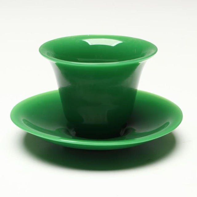 Set of four antique 19th century Chinese Peking glass tea cups and saucers. Wonderful bright green color. Saucers measure...