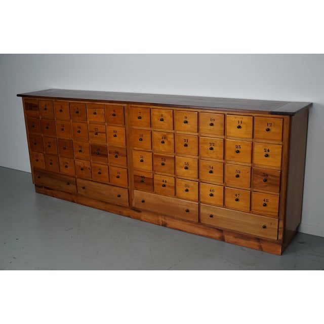 This apothecary bank of drawers was designed and made circa 1950 in the Netherlands. It was made from beech and it...