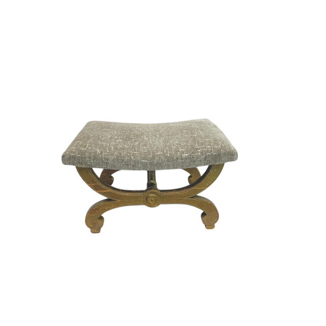 A French vintage rectangular footstool with a Curule-style base. The stool is perfect for use as a small bench or stool;...