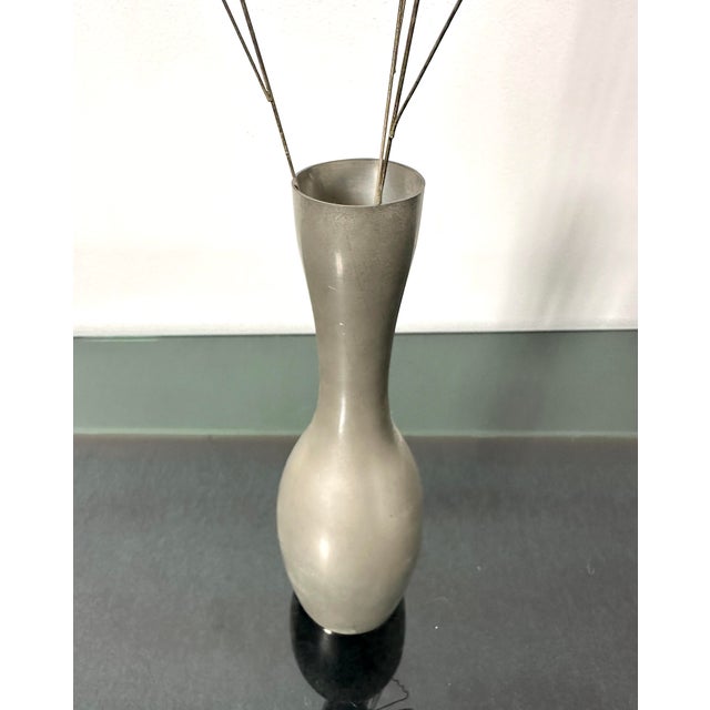 A refined artistic composition from the 1970s that combines the craftsmanship of metal with the lightness of natural...