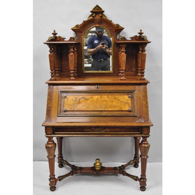Antique Victorian Carved Burl Walnut Slant Front Bookcase Secretary Writing Desk with Mirror. Item features beautiful wood...