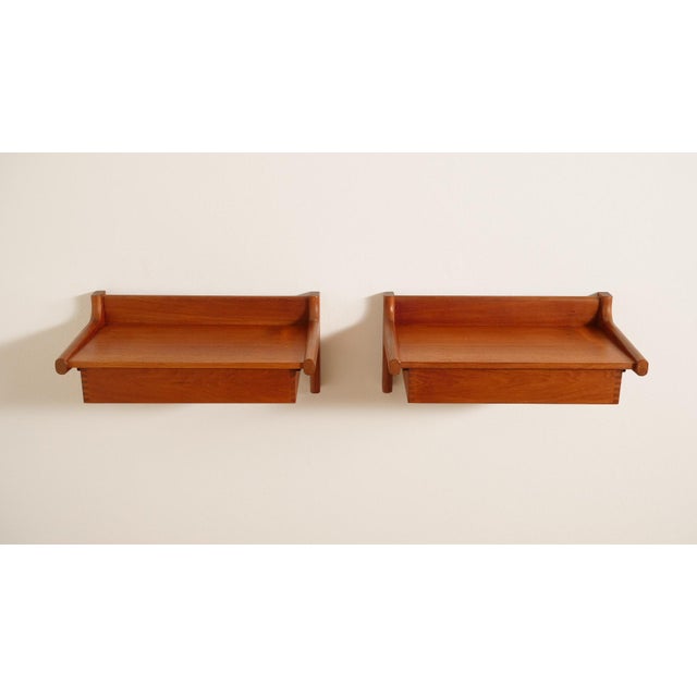 Set of 2 super beautiful and rare vintage bedside tables from Denmark. These floating bedside tables are fixed to the...